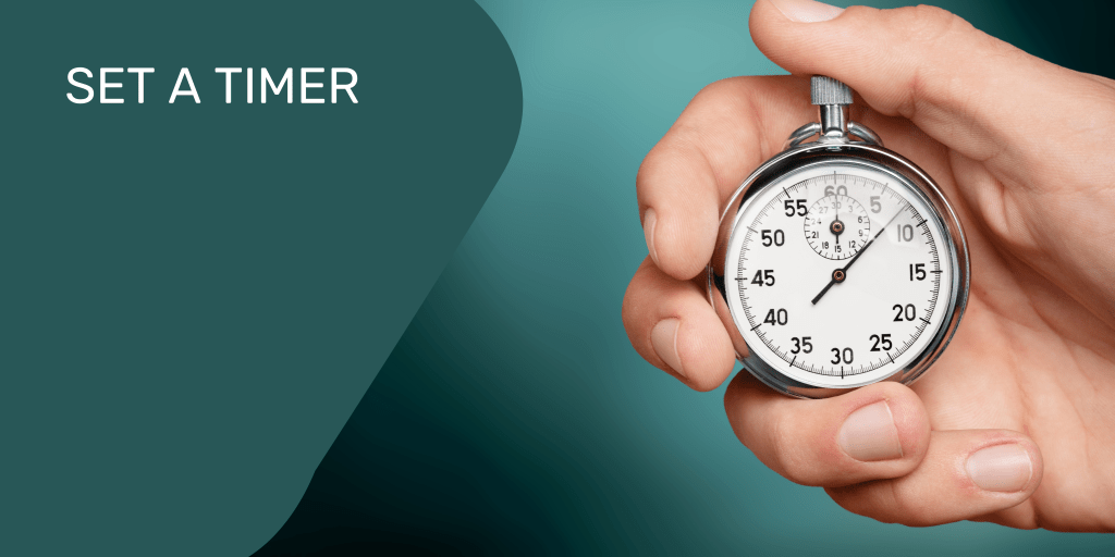 Retro style timer in white hand with short nails, getting set to spend five minutes being creative 