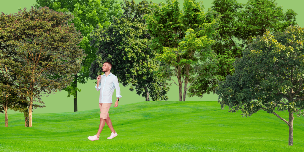 Happy man walking through trees on green screen to recover from artist rejection 