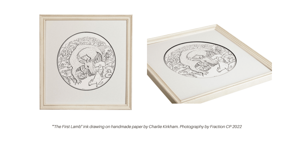 charlie kirkham pen and ink drawing of a dragon eating a lamb in a cave, photographed in frame by Fraction CP