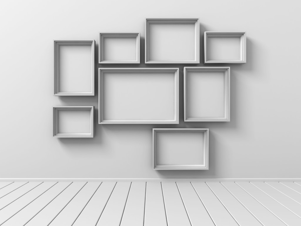 grey room with grey empty frames on wall for decor