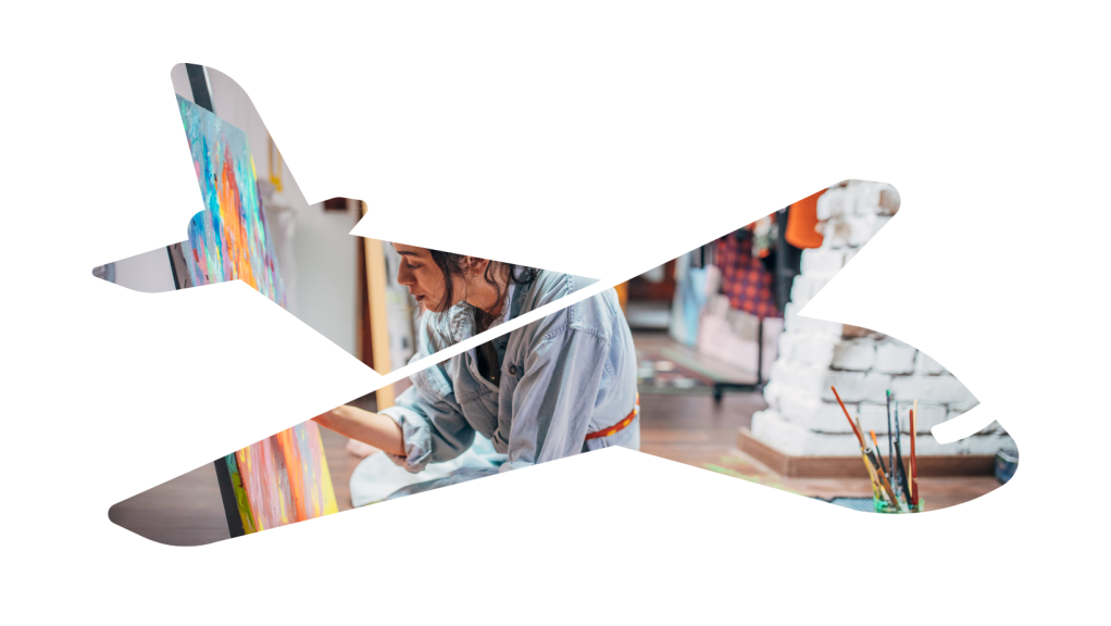 an artist painting inside a silhouette of an airplane to encourage airplane mode focus for creativity 