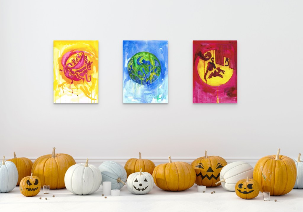 Watercolour and Oil loose paintings by artist Charlie Kirkham displayed next to a floor of jack a latern pumpkins 