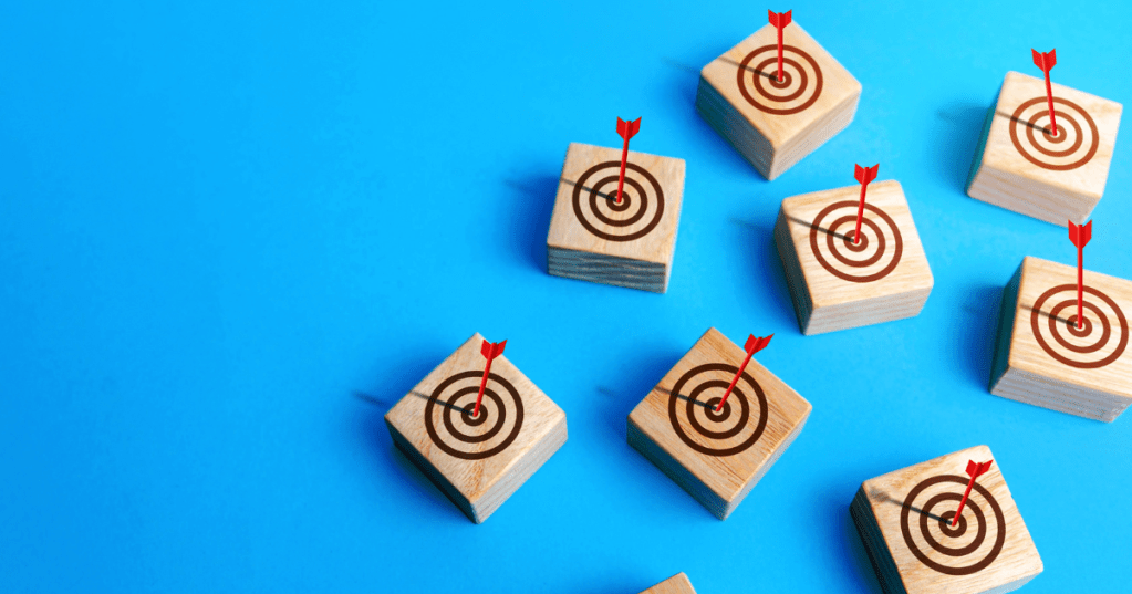 block target with darts hitting the bullset middle goal