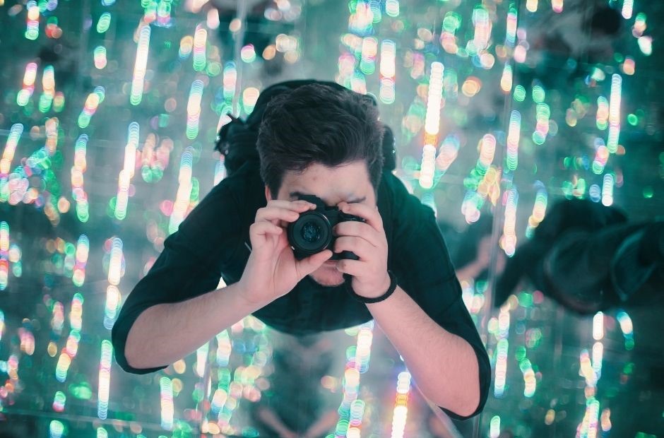 photographer in light club setting looking up